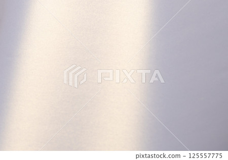 Pearlescent paper background with a smooth satin texture and soft curved surface. Gentle pastel 125557775
