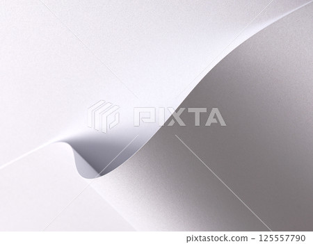 White pearl paper background with a satin, glossy texture and softly folded waves. Pale grey and icy 125557790