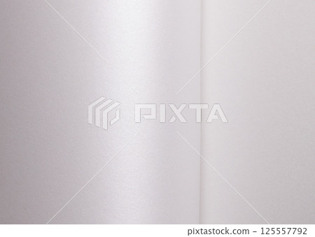 White satin paper background with a glossy, smooth texture and folded vertical waves. Pale grey and 125557792
