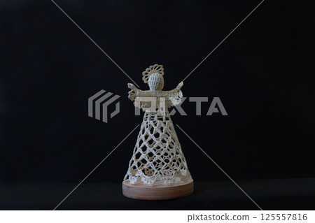 White angel on a dark background White angel on a dark background 125557816