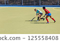 Two field hockey players fighting for the ball during the match 125558408