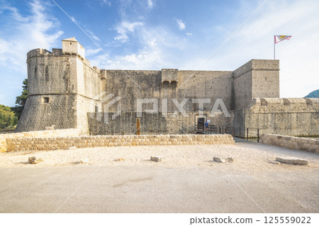 Ston, historic town in Peljesac peninsula in Croatia, Europe. Historical stone fortress under a cloudy sky, showcasing its architectural design and a glimpse into its past. Ston, historic town in Peljesac peninsula in Croatia, Europe. Historical stone fortress under a cloudy sky, showcasing its architectural design and a glimpse into its past. 125559022