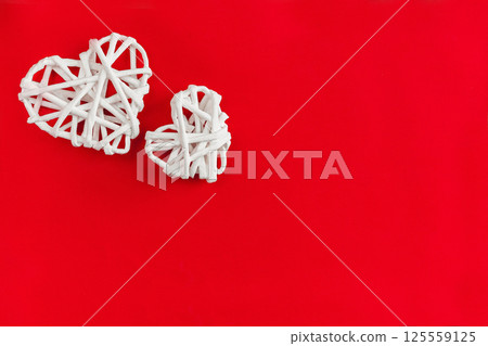 White Woven Hearts on a Bold Red Background Symbolizing Love and Emotion 125559125