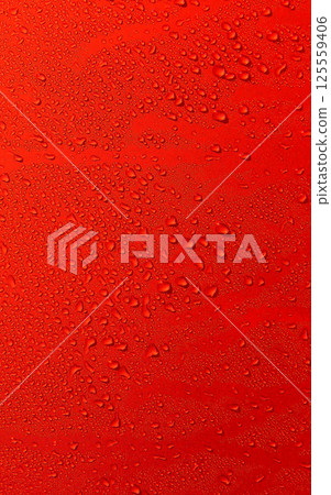 Pattern of liquid drops on red glossy surface. Stock Photo For Droplets Vertical Backgrounds 125559406
