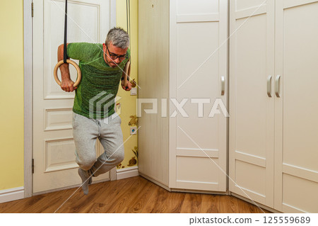 Strength training with gymnastic rings at home 125559689