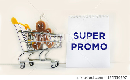 Notepad with the text SUPER promotion, super promotions for various products sold in supermarke Notepad with the text SUPER promotion, super promotions for various products sold in supermarke 125559797