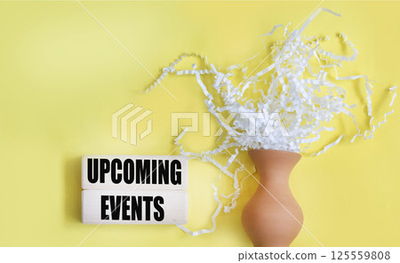 A message about the concept of upcoming events on blocks and a yellow background A message about the concept of upcoming events on blocks and a yellow background 125559808
