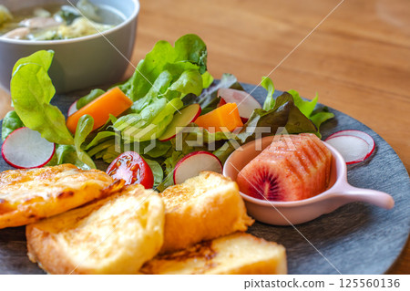 French toast and colorful salad breakfast plate 125560136