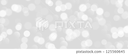 White bokeh, blurred grey background with sparkling lights, blurry glitter effect. 125560645