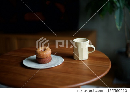 Two donuts and hot coffee for snack Two donuts and hot coffee for snack 125560910