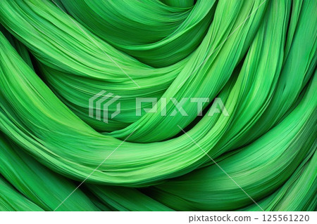 Spiral tendrils of a climbing vine showcasing vibrant green hues under natural light 125561220