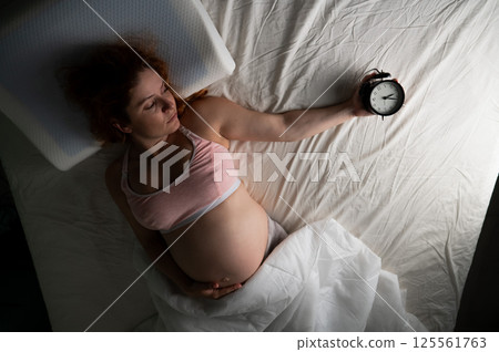 Pregnant woman suffers from insomnia.  125561763