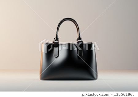 Elegant handbag displayed elegantly on a clean surface with soft lighting and sleek design 125561963