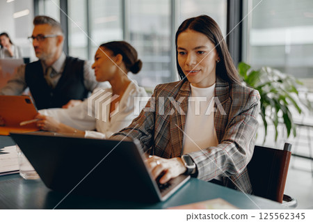 Attending a Professional Business Meeting focused on Collaborative Teamwork for effective results Attending a Professional Business Meeting focused on Collaborative Teamwork for effective results 125562345