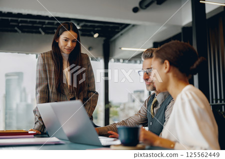 Engaging and Collaborative Business Meeting Held in a Contemporary Modern Office Space 125562449