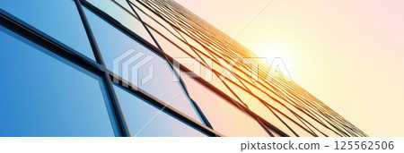 Striking glass pyramid structure reflects sunset in minimalistic backdrop with ample copy space 125562506