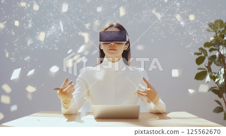 Businesswoman sitting at a modern desk, wearing virtual reality goggles and engaging with dynamic digital data, immersing herself in a captivating virtual world filled with innovation 125562670