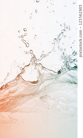 Dynamic water splashing, creating ripples and drops on a gradient background, capturing the fluidity and motion of liquid in an artistic and visually appealing way 125562905