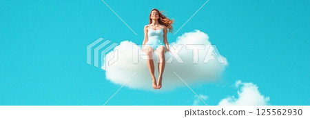 Surreal image of a young woman with long red hair, wearing light blue summer clothes, meditating while sitting on a white cloud levitating in a clear blue sky, enjoying freedom and tranquility 125562930