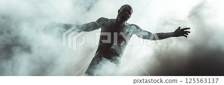 Scary, screaming dark zombie with open arms emerging from toxic smoke, haunting a post apocalyptic landscape during a chilling zombie apocalypse filled with fear and danger 125563137