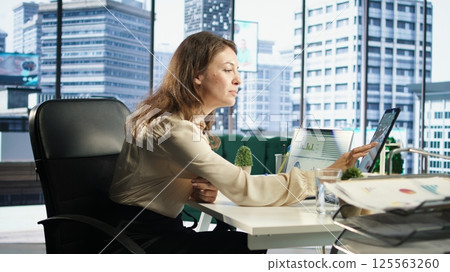 Ambitious female leader developing a strategic plan for business growth, aligning the company efforts with the enterprise vision and market opportunities for global expansion. Camera A. Ambitious female leader developing a strategic plan for business growth, aligning the company efforts with the enterprise vision and market opportunities for global expansion. Camera A. 125563260