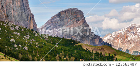 Stunning mountain landscape in the dolomites with rolling hills and majestic peaks near Valley of Funes at Dolomites, Italy Stunning mountain landscape in the dolomites with rolling hills and majestic peaks near Valley of Funes at Dolomites, Italy 125563497