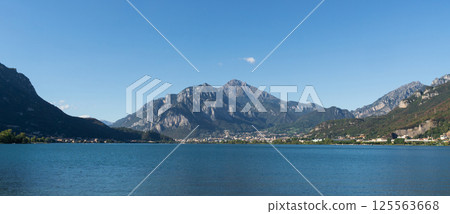 Calm Lake with Mountain and Clear Sky near Lecco, lake Como 125563668