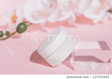 Firming Cream Jar mockup with Floral Pink Background on Acrylic Block Firming Cream Jar mockup with Floral Pink Background on Acrylic Block 125563682