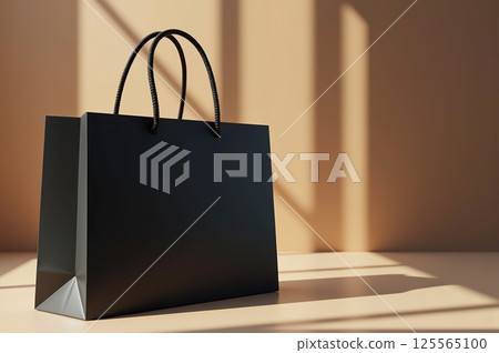 Elegant black shopping bag on beige background with dramatic shadows. AI generation Elegant black shopping bag on beige background with dramatic shadows. AI generation 125565100
