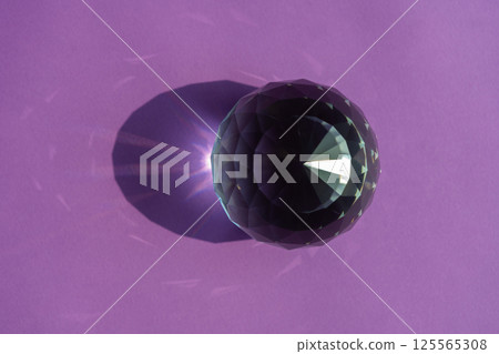 Crystal prism refracting light, magic crystals and pyramid, sphere and cube on purple background. Spiritual healing crystal practice. Feng Shui, good energy flow concept.. 125565308