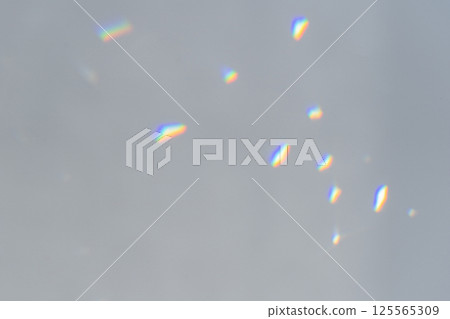 Abstract prism reflection, rays leaking through lens effect. Crystal light reflections for overlay mockup on light background. Rainbow holographic shadow mock up, iridescent prismatic 125565309