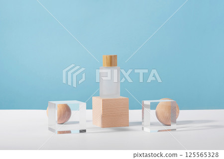 Medical skincare and cosmetic cream mockup on wooden block pedestal podium with stylish props, glass acrylic balls. Lotion, concealer beauty product packaging. Product presentation 125565328