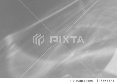 Caustic effect light refraction on white wall overlay photo mockup, blurred sun rays refracting through glass prism with shadow. Abstract natural light refraction silhouette on water surface 125565373