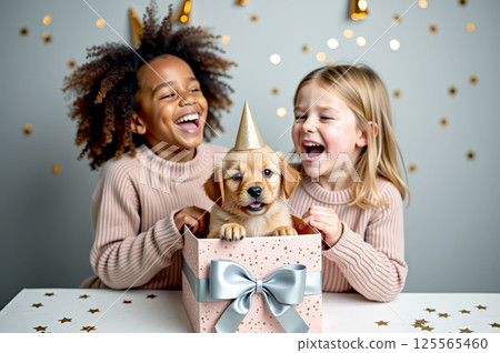 Joyful birthday celebration with kids and puppy gift surprise 125565460