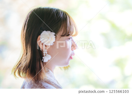 Profile of a young woman wearing a yukata 125566103