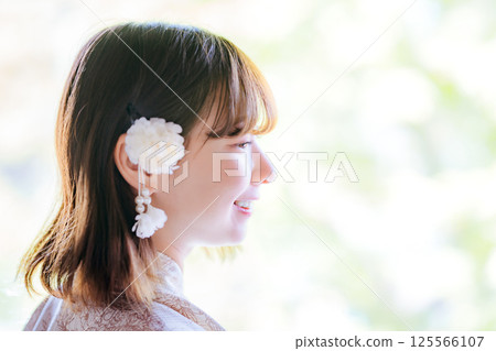 Profile of a young woman wearing a yukata 125566107