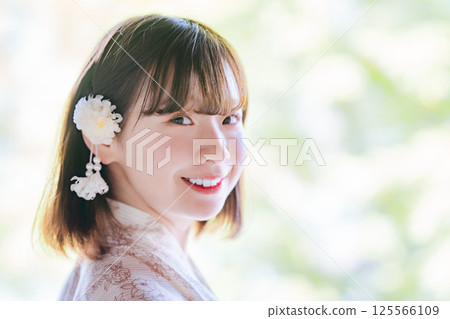 Profile of a young woman wearing a yukata 125566109