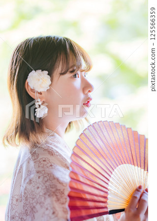 Profile of a young woman wearing a yukata Profile of a young woman wearing a yukata 125566359