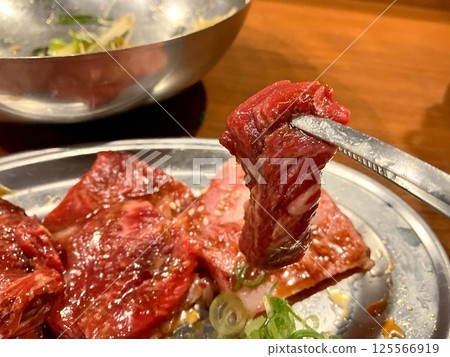 Grilled meat on a charcoal grill 125566919