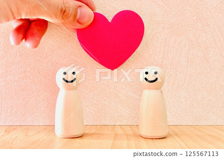 Two smiling people and a heart Two smiling people and a heart 125567113