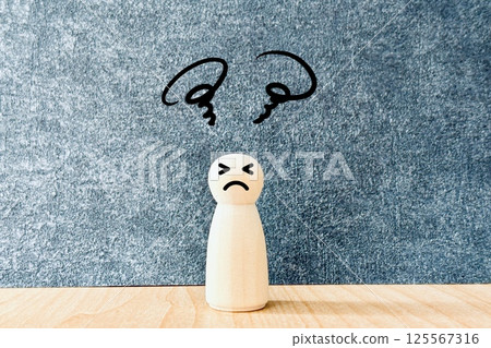 A person whose head is confused A person whose head is confused 125567316