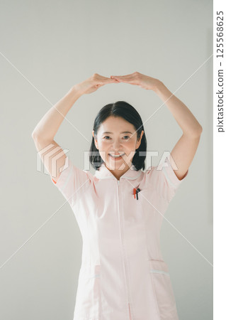 Nurse in her 50s Nurse in her 50s 125568625