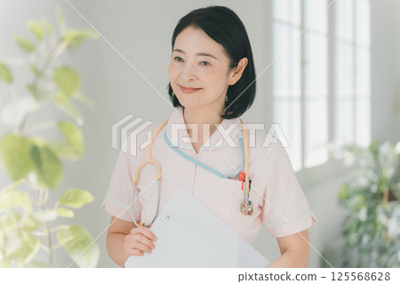 Nurse in her 50s Nurse in her 50s 125568628