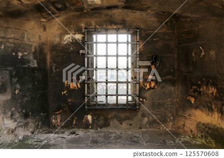 A window for observation on the wall of Edinburgh Castle in Scotland, England 125570608