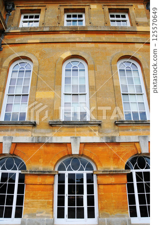 windows on yellow brick walls windows on yellow brick walls 125570649