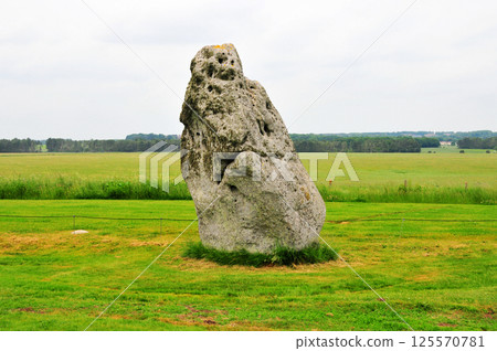 An ancient huge rock standing in the field, near Stonehenge in England, England An ancient huge rock standing in the field, near Stonehenge in England, England 125570781