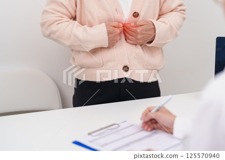 Senior Woman Chest ache. Elderly Patient consultation medical health for Liver cancer and Tumor, Jaundice, Viral Hepatitis, Cirrhosis, Failure, Enlarged, Hepatic Encephalopathy and healthcare 125570940