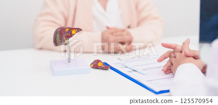 Doctor with human Liver anatomy. Elderly Patient consultation medical health for Liver cancer and Tumor, Jaundice, Viral Hepatitis, Cirrhosis, Failure, Enlarged, Hepatic Encephalopathy, Ascites Fluid Doctor with human Liver anatomy. Elderly Patient consultation medical health for Liver cancer and Tumor, Jaundice, Viral Hepatitis, Cirrhosis, Failure, Enlarged, Hepatic Encephalopathy, Ascites Fluid 125570954