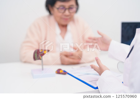 Doctor with human Liver anatomy. Elderly Patient consultation medical health for Liver cancer and Tumor, Jaundice, Viral Hepatitis, Cirrhosis, Failure, Enlarged, Hepatic Encephalopathy, Ascites Fluid 125570960