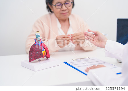 Doctor with Respiratory system. Elderly Patient consultation medical health for Lung Cancer, Asthma, Chronic Obstructive Pulmonary, Bronchitis, Emphysema, Cystic Fibrosis, Bronchiectasis, Pneumonia 125571194